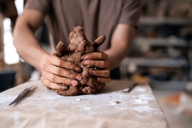 Front view man clay sculpting