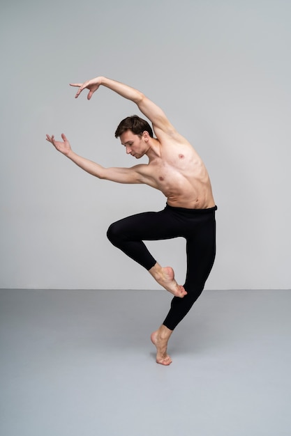 Front view man dancing in studio