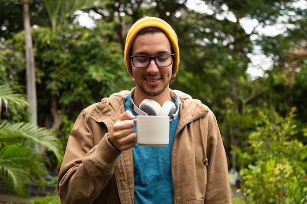 Free photo front view of man drinking coffee