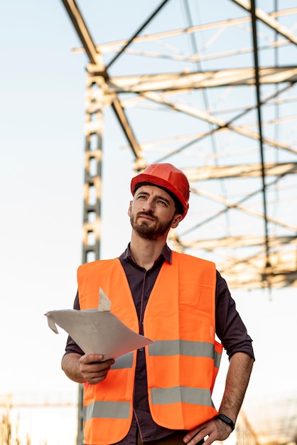 Front view of man holding plan