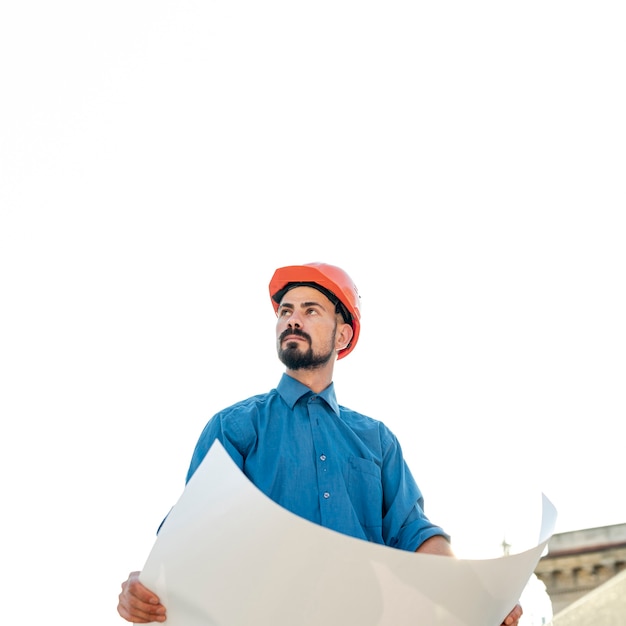 Free photo front view of man holding schematics