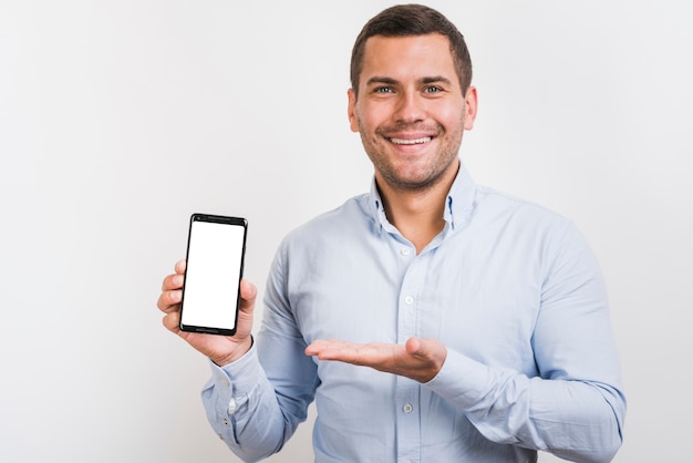 Front view of man holding a smartphone