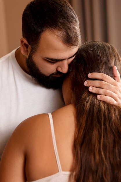 Front view man holding woman