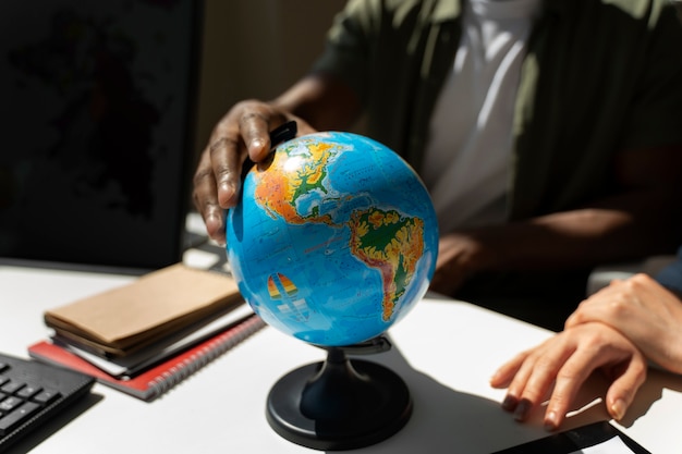 Front view man holding world globe