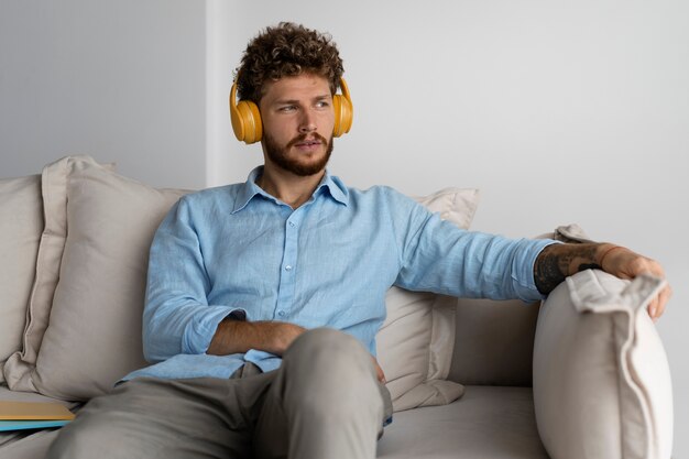 Front view man listening to music