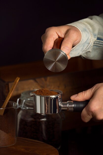 Front view man making coffee