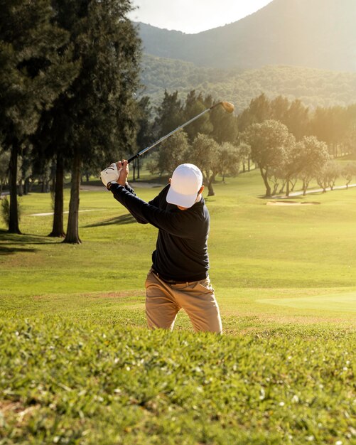 Front view of man playing golf