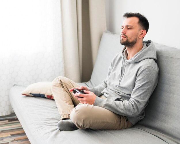 Front view of man playing video games