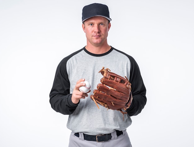 Free photo front view of man posing with baseball and glove