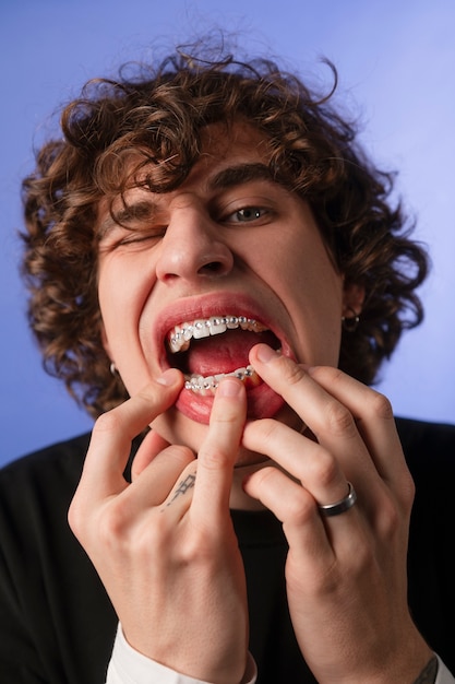 Front view man posing with dental gems