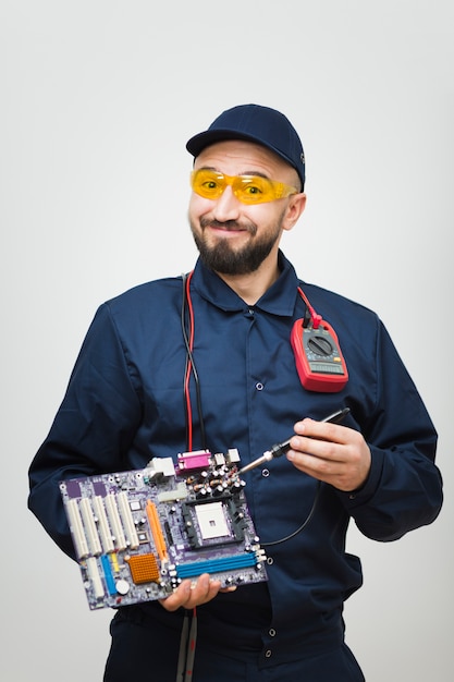 Front view man repairing a computer