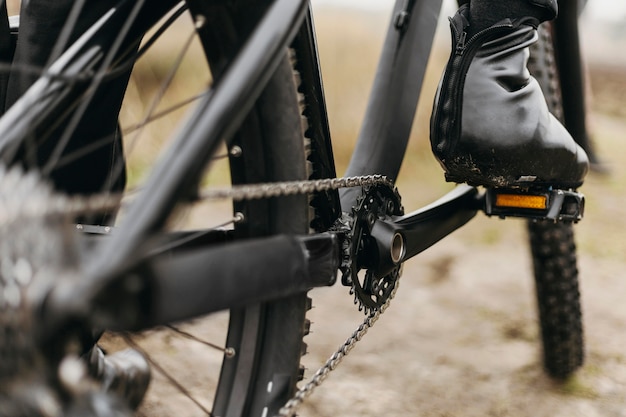 Free photo front view of man riding a bike