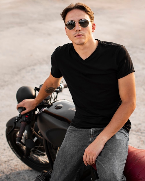 Front view man sitting on motorcycle