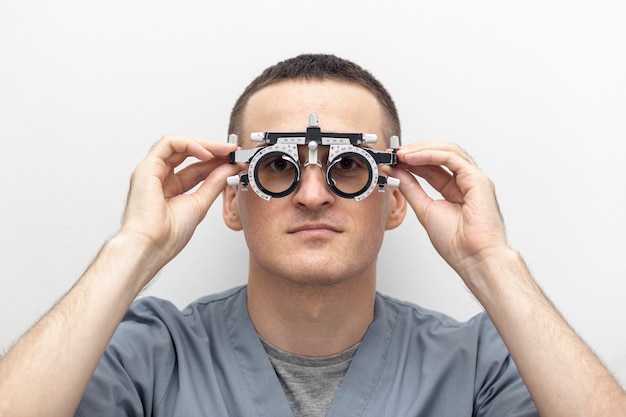 Front view of man trying on optics equipment