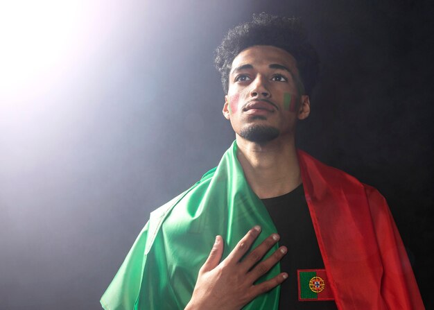 Front view of man wearing the portugal flag