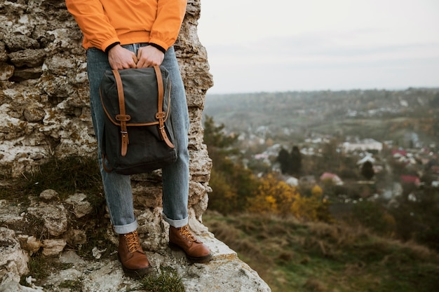 Free photo front view of man with backpack on a road trip