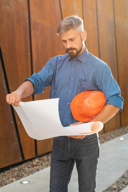 Front view of man with blueprint