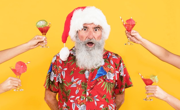 Free photo front view of man with tropical shirt and christmas hat