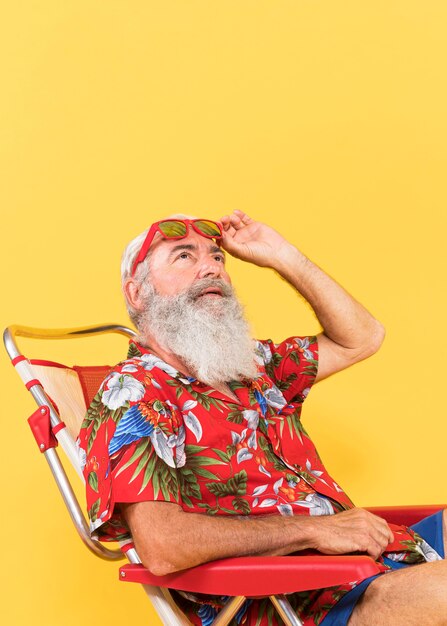 Front view of man with tropical shirt and copy space