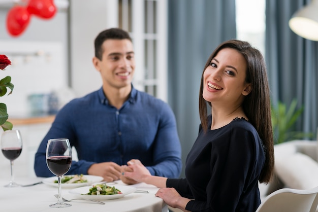 Front view man and woman having a romantic dinner together