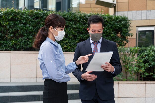 Front view of man and woman wearing face mask