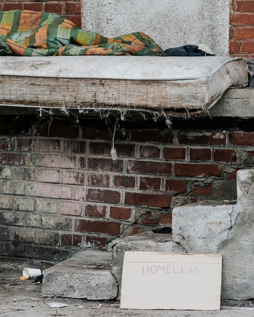 Front view of mattress with blanket for homeless people