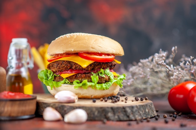 Front view meat burger with french fries on dark background