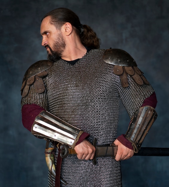 Free Photo front view medieval soldier posing in studio