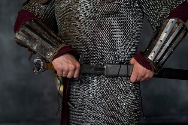 Free photo front view medieval soldier posing in studio