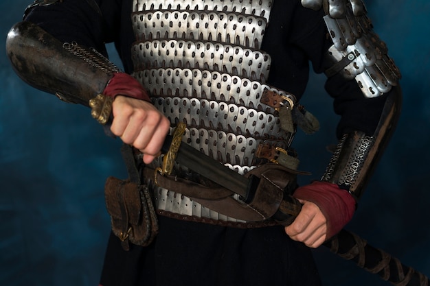 Front view medieval soldier posing in studio