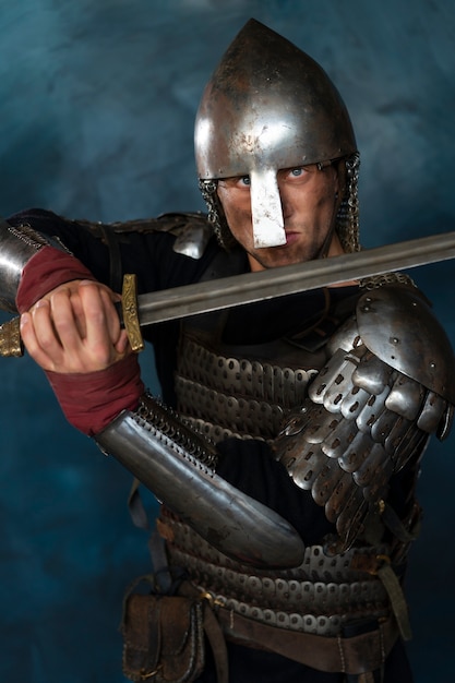 Free Photo front view medieval soldier posing in studio