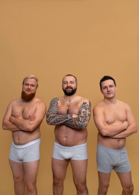 Front view men posing together in studio