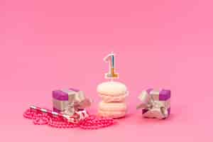 Free photo a front view meringues and boxes on pink, cake color birthday