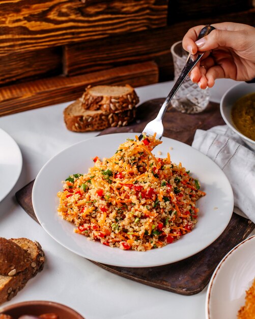 Front view minced rice with vegetables colorful on the brown surface