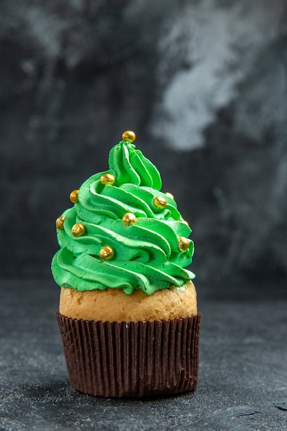 Free photo front view mini xmas tree cupcake on dark