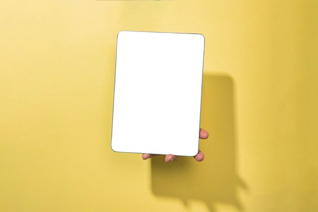 Front view mockup tablet held by person