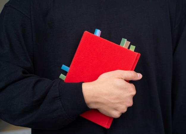 Front view model holding book