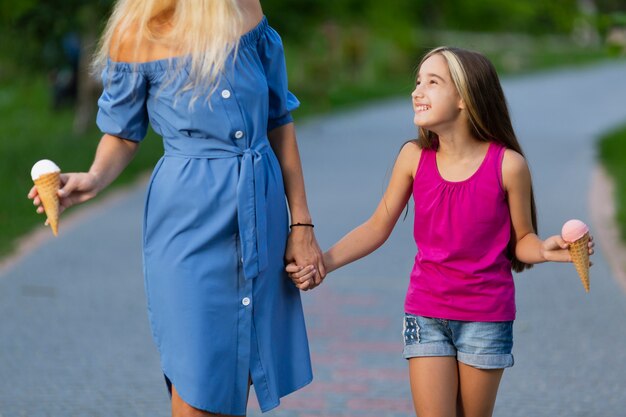 Front view of mom and daughter with ice cream