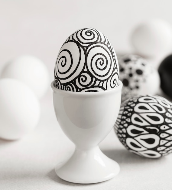 Free Photo front view of monochrome egg for easter in egg cup