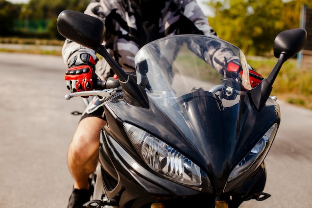 Front view of the motorbike with the biker on