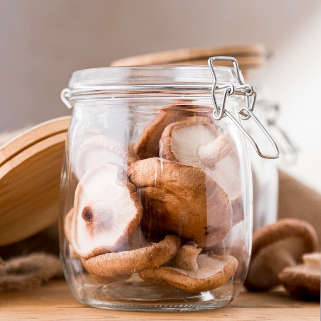 Front view of mushrooms in glass jar