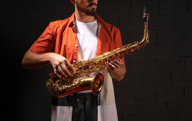 Front view of musician playing saxophone