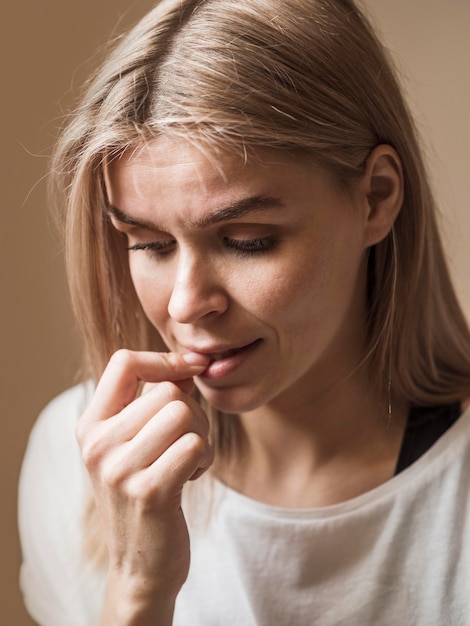 Free photo front view of nail biting bad habit concept