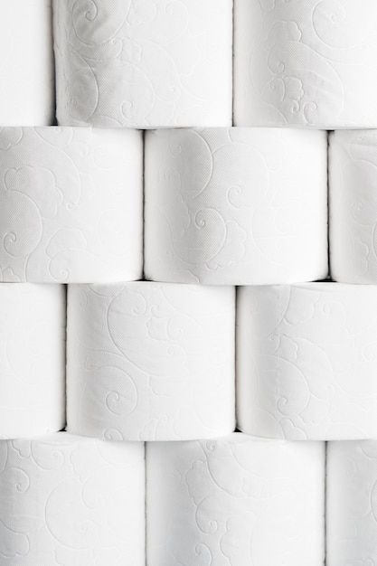 Front view of neatly stacked toilet paper rolls