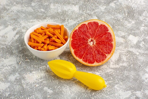 Front view orange rusks with grapefruit on the white desk