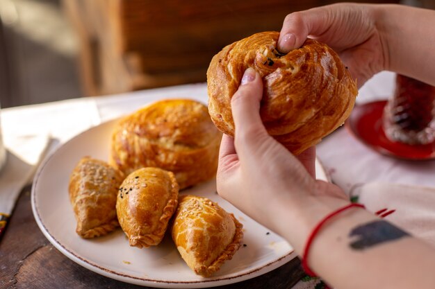 A front view pastries baked qogals and other bakeries cookies tea time tasty pastry dough ceremony on the table