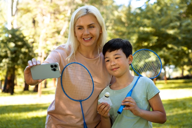 Front view people holding badminton rackets