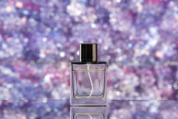 Front view perfume bottle on purple blurred background