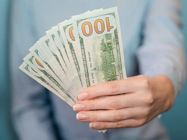 Front view of person holding money