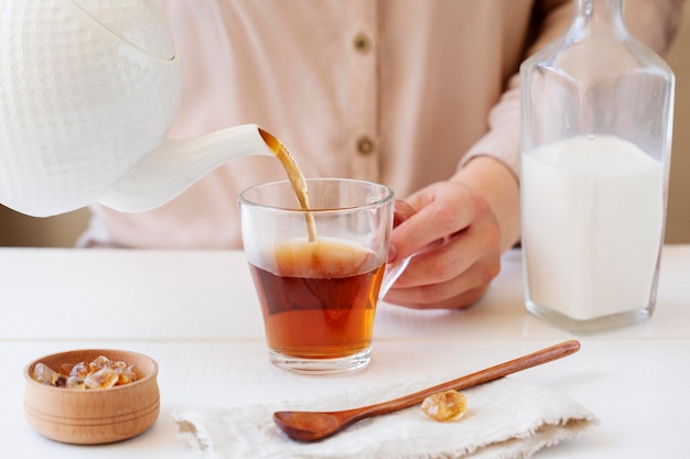 Front view of person preparing milk tea